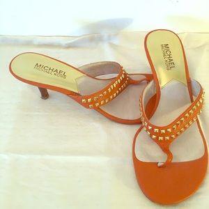 MK orange sandals.